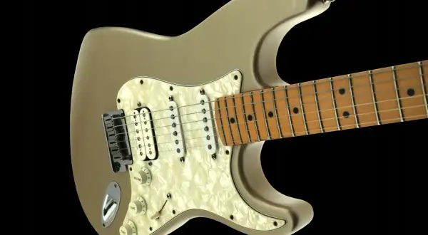 Złota elektryczna gitara, jakby wybiegły z niej dźwięki, gotowa do rockowych popisów.