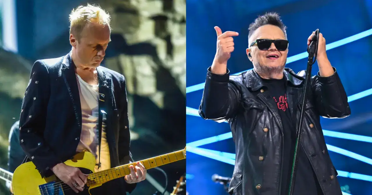 Muzyk z żółtą gitarą i wokalista w skórzanej kurtce, obaj w stylu king t love, na scenie.